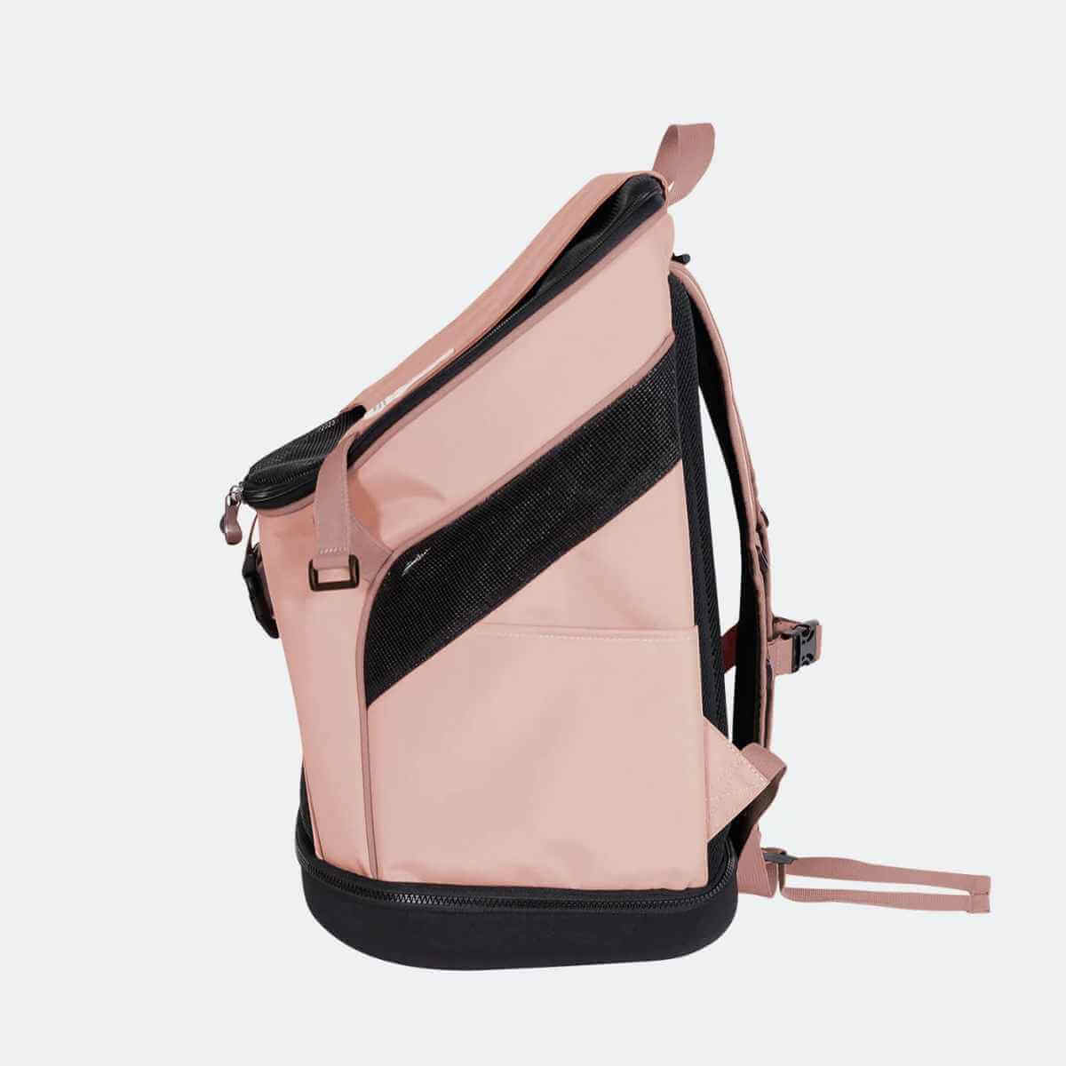 Profile view of the Coral Pink Ibiyaya pet backpack highlighting the sleek design and mesh ventilation.