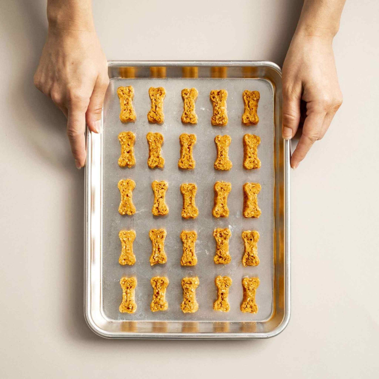 Polkadog Chicken Littles Crunchy Bone Shaped Dog Treats - on a baking sheet